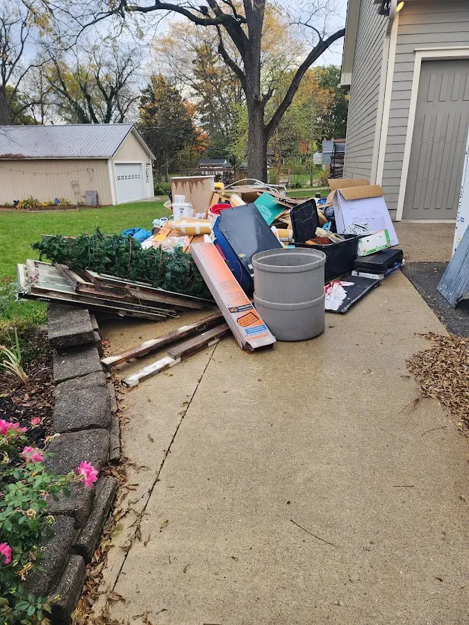 Dumpster being loaded with debris for 12 Yard Dumpster Rental in Nolanville